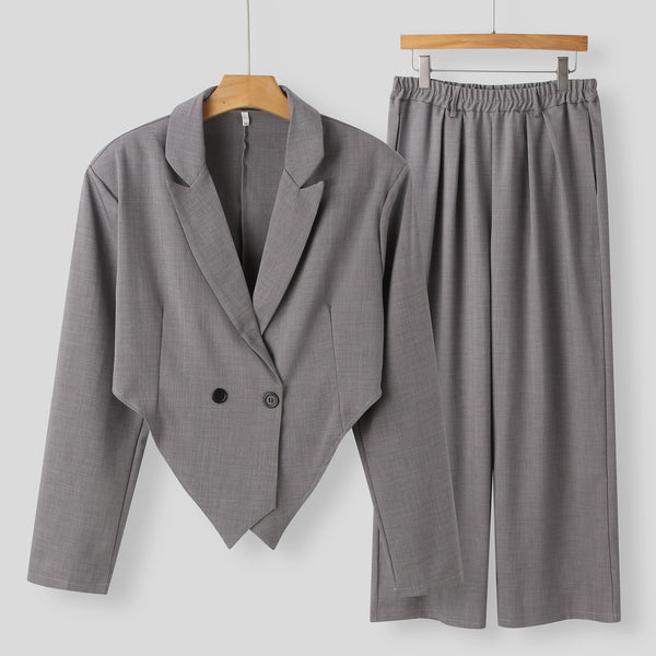 men's blazer set, blazer and trouser outfit, double-breasted blazer, wide-leg trousers, formal two-piece suit men, street style men's suit, modern men's fashion, black blazer suit men, gray blazer trouser set, statement suit outfit men
