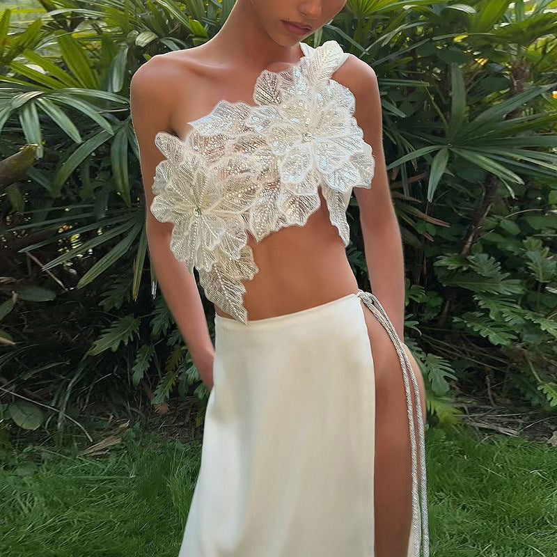 Black floral appliqué two-piece
Elegant evening wear for women
High-slit maxi skirt outfit
Black formal two-piece set
Glamorous cocktail party outfit
Red carpet-inspired fashion