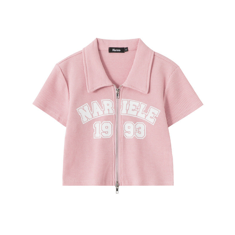 Vintage zip-up polo shirt
Cropped waffle knit top
Y2K aesthetic clothing
Varsity-style embroidered shirt
Trendy streetwear fashion