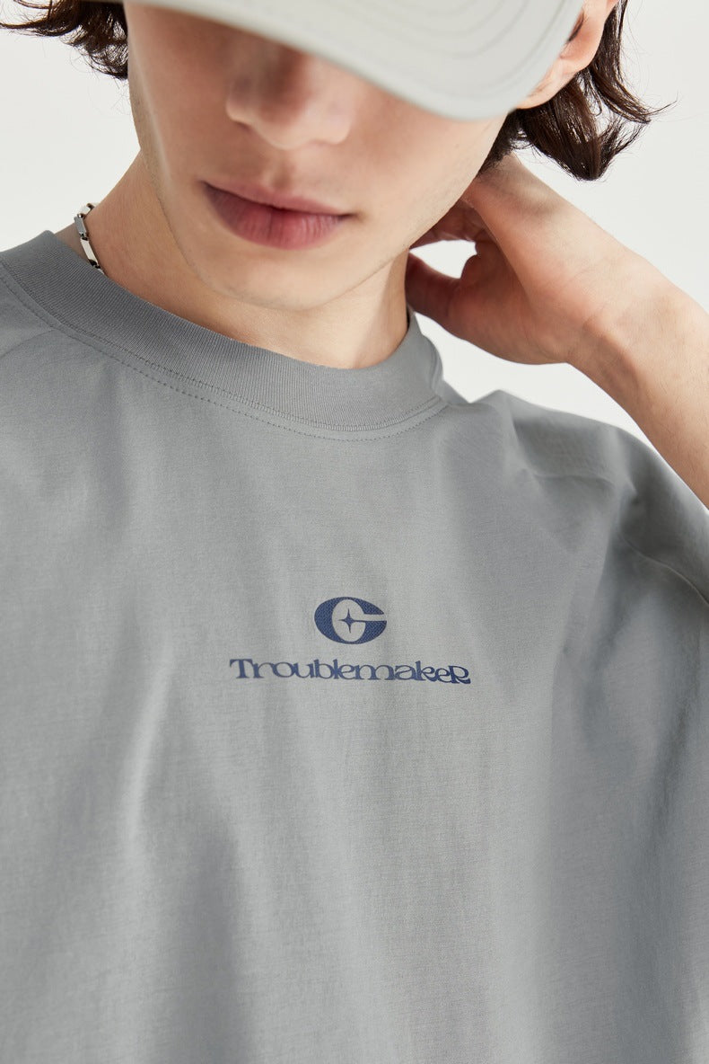  Unisex oversized T-shirt, streetwear fashion, gender-neutral T-shirt, contrast panel tee, trendy urban clothing, loose fit T-shirt, modern casual top