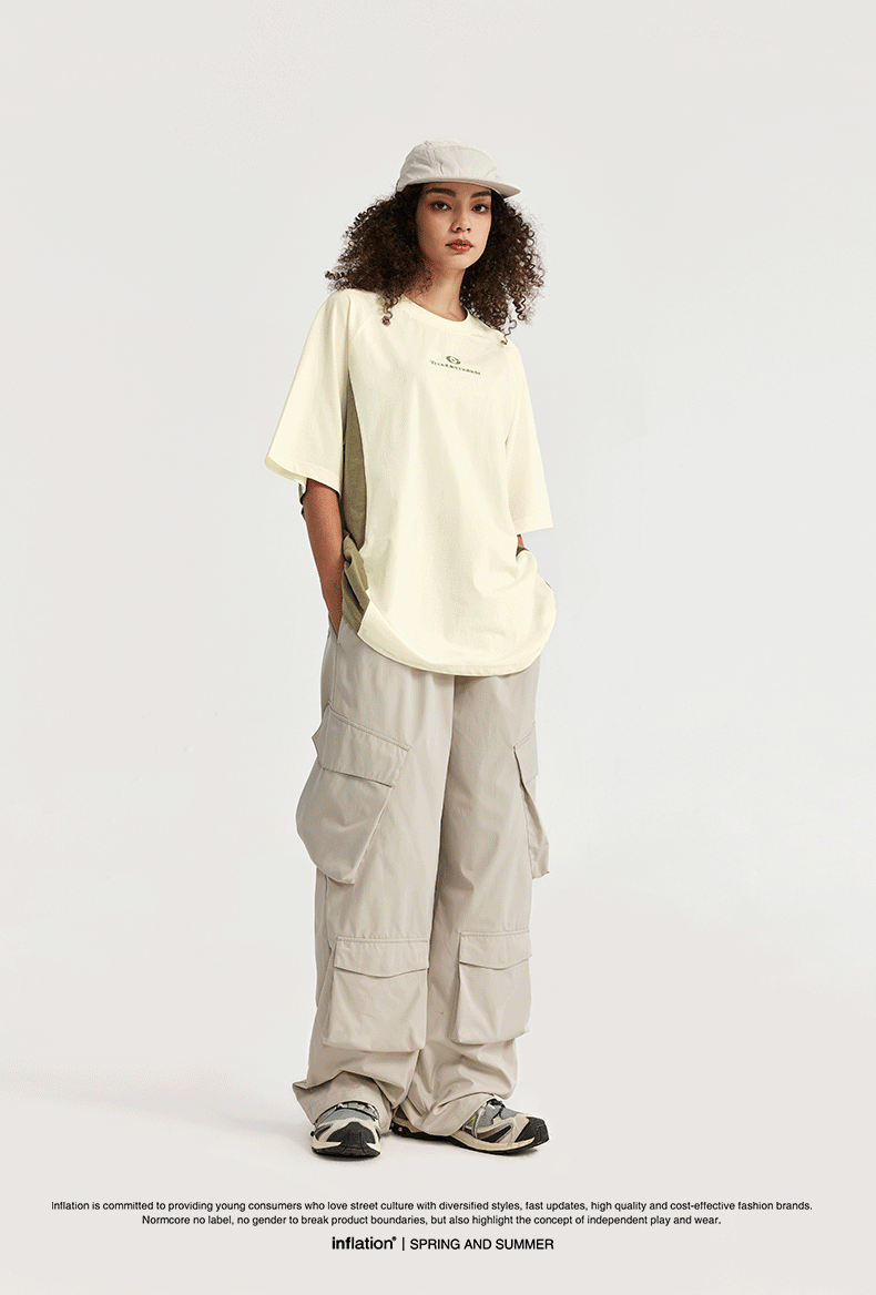  Unisex oversized T-shirt, streetwear fashion, gender-neutral T-shirt, contrast panel tee, trendy urban clothing, loose fit T-shirt, modern casual top
