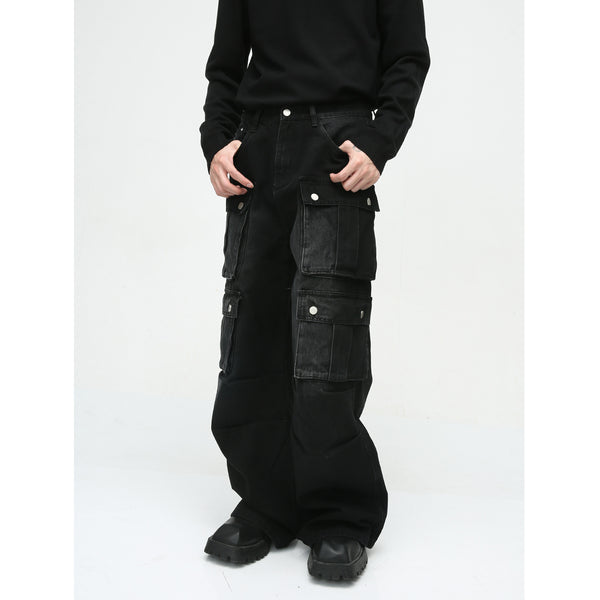 men's black cargo pants, wide-leg cargo pants, utility pants, high-waisted, multi-pocket, oversized, streetwear, cargo pants with pockets, relaxed fit, durable fabric, men’s pants, heavy-duty fabric, snap pockets, cargo pants for streetwear, functional design, trendy utility pants, black utility pants, men’s street style, relaxed oversized fit, versatile utility pants, basic tee styling, on-the-go wardrobe, modern utility fashion,