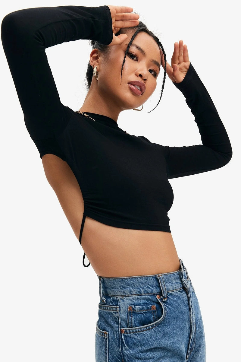 Open back crop top
Sexy long sleeve top
Backless crop top
Trendy women’s tops
Streetwear fashion
Party outfit for women
Clubwear crop top
Fashionable black top
High neck crop top
Elegant casual wear