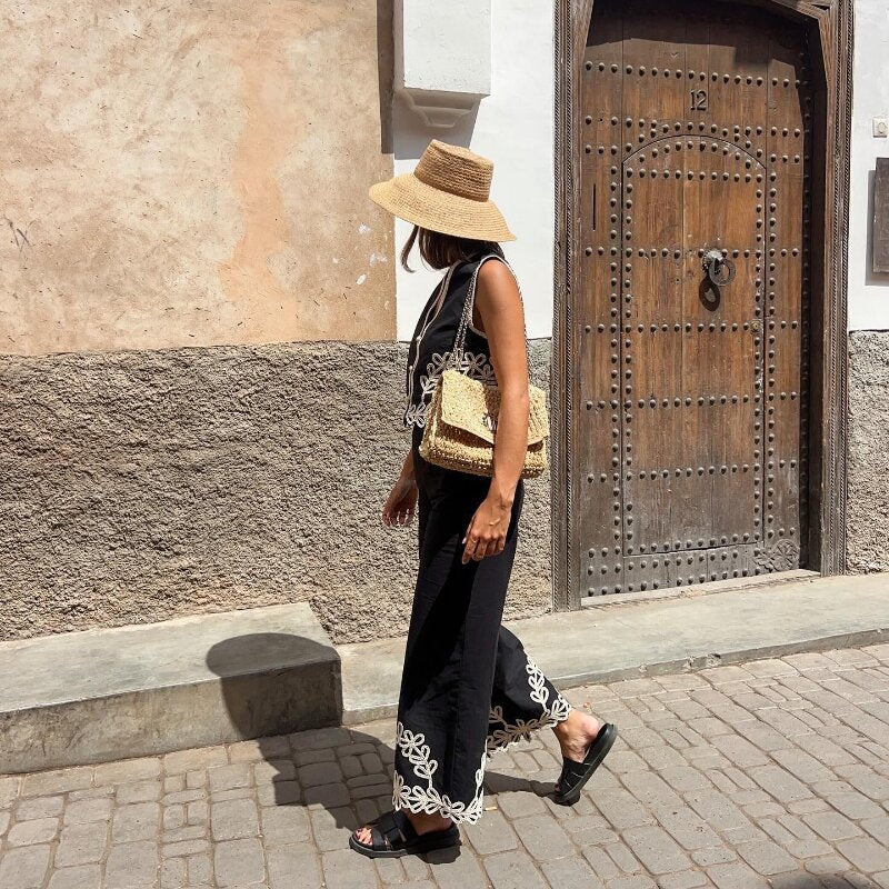 Boho black two-piece set
Embroidered summer outfit
Chic vacation outfit for women
Stylish wide-leg pants set
Resort wear fashion 2024
Bohemian matching set