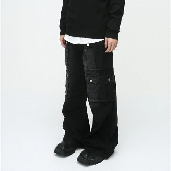 men's black cargo pants, wide-leg cargo pants, utility pants, high-waisted, multi-pocket, oversized, streetwear, cargo pants with pockets, relaxed fit, durable fabric, men’s pants, heavy-duty fabric, snap pockets, cargo pants for streetwear, functional design, trendy utility pants, black utility pants, men’s street style, relaxed oversized fit, versatile utility pants, basic tee styling, on-the-go wardrobe, modern utility fashion,