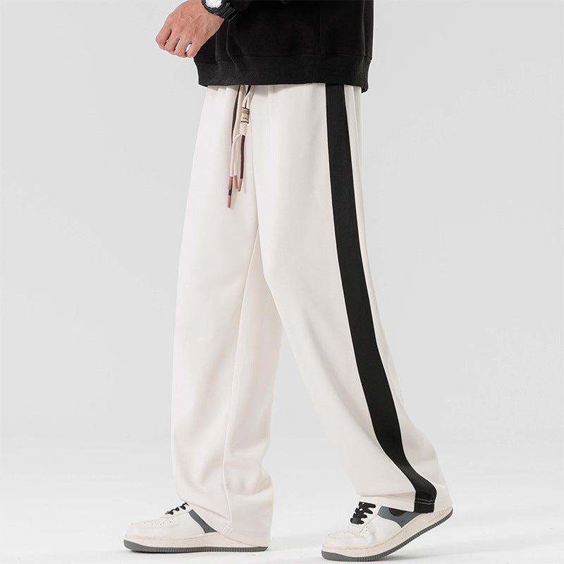 Men's wide-leg track pants
Streetwear pants for men
Casual sporty trousers
Relaxed fit track pants
Fashionable athletic pants