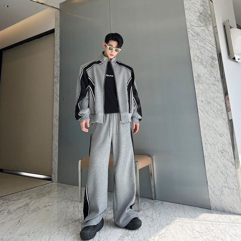 Men’s tracksuit set
Retro tracksuit for men
Two-piece sports outfit
Stylish men’s activewear
Zip-up track jacket
Streetwear fashion tracksuit
Wide-leg pants set