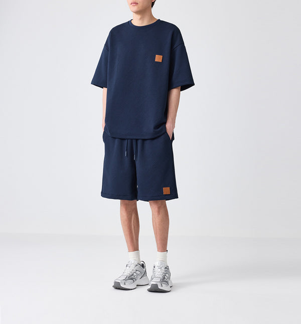 luxury lounge set
premium textured outfit
embossed t-shirt and shorts
oversized tee and shorts set
streetwear fashion
Casual co-ord set for men
Casual men’s co-ord set
Knitted cord set
cozy summer outfit
minimalist casual wear
soft-touch lounge set