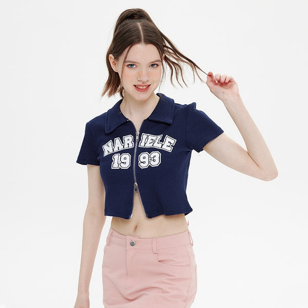 Vintage zip-up polo shirt
Cropped waffle knit top
Y2K aesthetic clothing
Varsity-style embroidered shirt
Trendy streetwear fashion