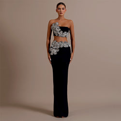 Black strapless evening gown
Embellished formal dress
Black crop top and skirt set
Embellished two-piece evening outfit
Luxury crystal gown
Elegant two-piece dress
Designer evening skirt and top
High-slit skirt with beaded top
Glamorous two-piece party set
Designer evening wear
Red carpet dress
Floral embellished tube gown
Beaded formal outfit