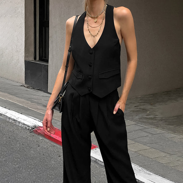 Chic black vest and trousers set
Women’s tailored two-piece suit
Elegant wide-leg pants outfit
Modern power dressing for women
Minimalist fashion co-ord
Trendy street-style outfit