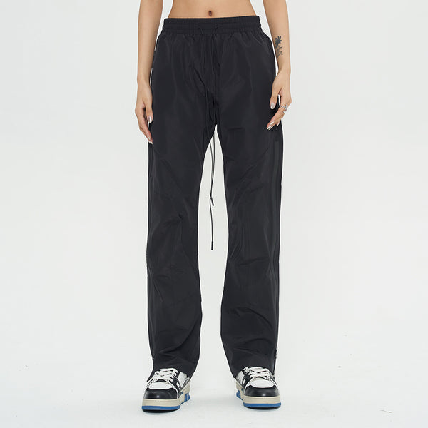 Black joggers for women
Streetwear windbreaker pants
Lightweight joggers with drawstring
Casual loose-fit pants
Urban fashion trousers
Athletic track pants
Comfortable sports joggers