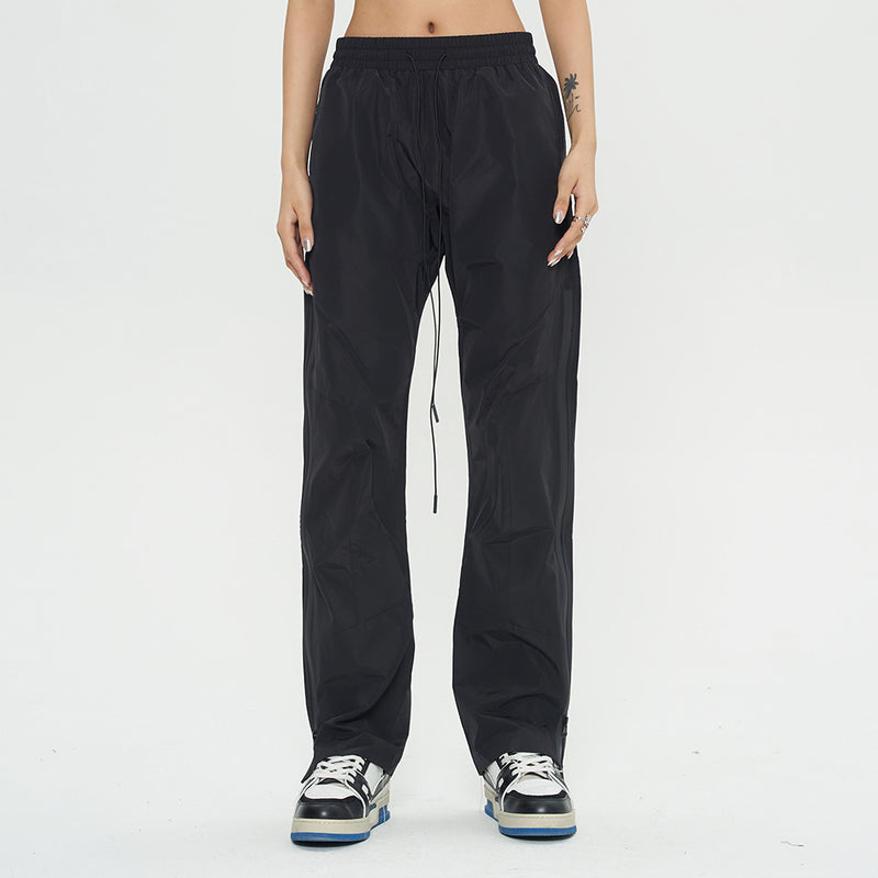 Black joggers for women
Streetwear windbreaker pants
Lightweight joggers with drawstring
Casual loose-fit pants
Urban fashion trousers
Athletic track pants
Comfortable sports joggers