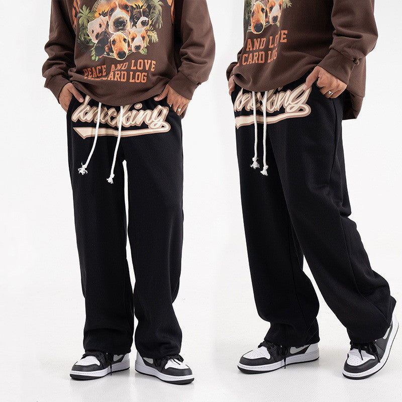 Unisex hip-hop sweatpants, streetwear joggers, relaxed fit pants, casual street style, urban fashion, lightweight joggers, breathable sweatpants, adjustable drawstring, multiple pockets joggers, street fashion trousers, versatile joggers, hip-hop wardrobe, trendy casual pants, athletic joggers, everyday sweatpants, gym joggers, lounging pants, stylish sweatpants, men’s streetwear, women’s casual joggers.