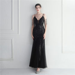 Black evening gown
Sequin formal dress
Luxury evening dress
Designer gown for women
Elegant party dress
Wedding guest dress
Red carpet evening wear
Formal event gown
Shoulder chain dress
Deep V-neck gown
Floor-length sequin dress