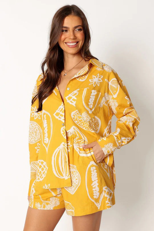 printed two-piece tropical outfit

casual matching lounge sets

women’s summer matching sets

resort wear for women

trendy fruit print clothingtropical fruit print outfit

button down co-ord set

women’s resort set

elastic waist tropical shorts

two piece casual lounge set

relaxed fit vacation outfit

