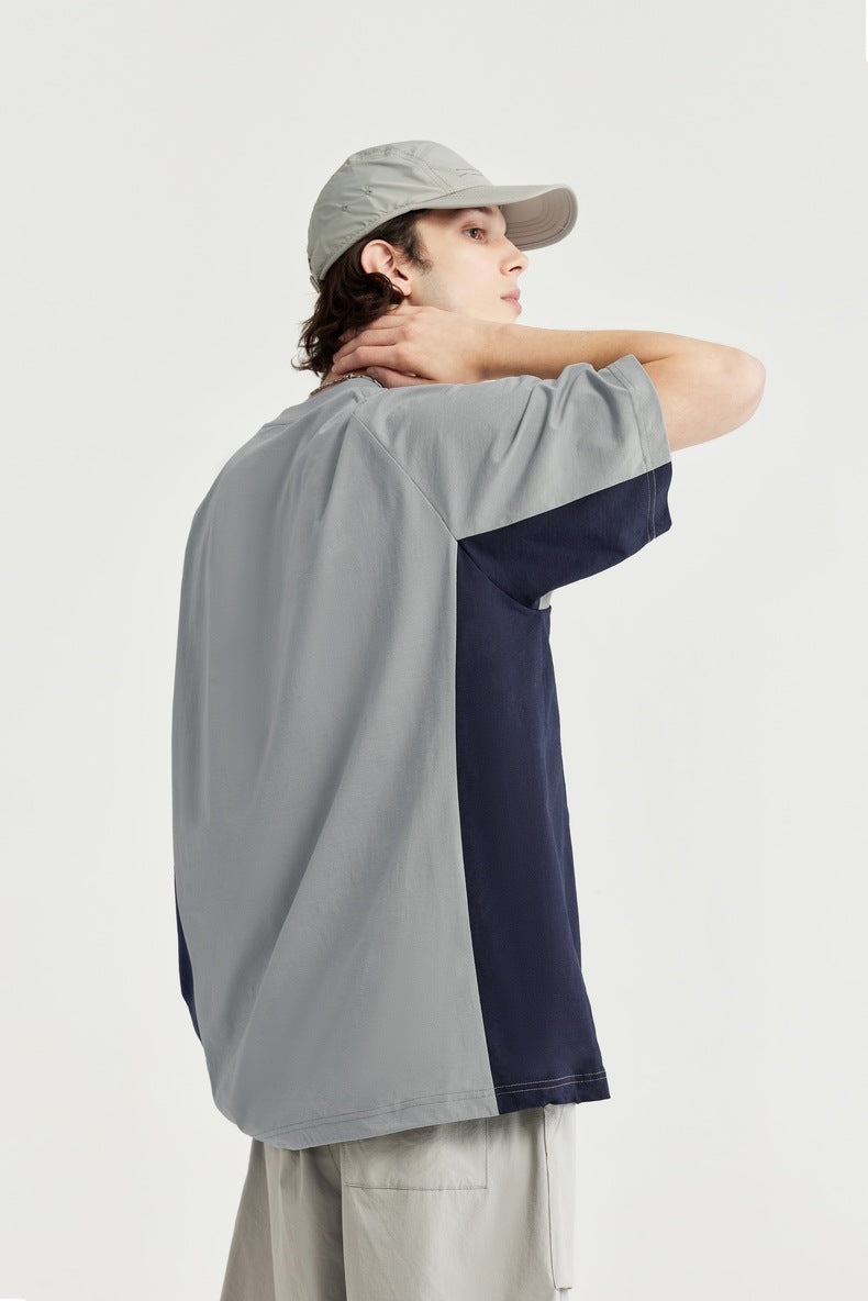  Unisex oversized T-shirt, streetwear fashion, gender-neutral T-shirt, contrast panel tee, trendy urban clothing, loose fit T-shirt, modern casual top