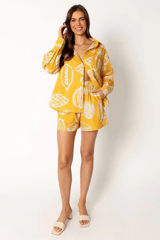printed two-piece tropical outfit

casual matching lounge sets

women’s summer matching sets

resort wear for women

trendy fruit print clothingtropical fruit print outfit

button down co-ord set

women’s resort set

elastic waist tropical shorts

two piece casual lounge set

relaxed fit vacation outfit

