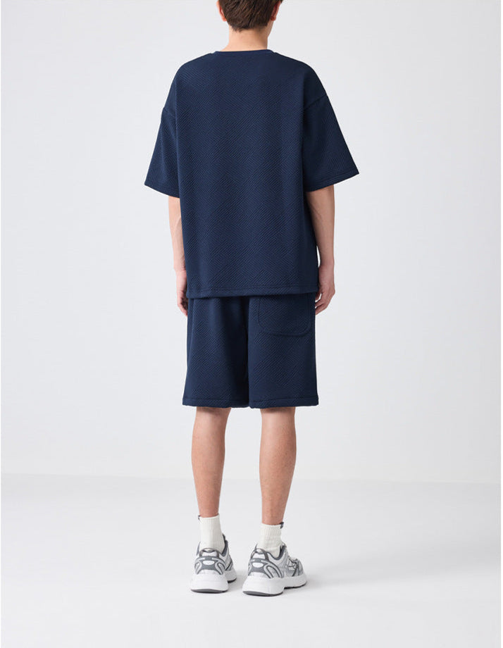 luxury lounge set
premium textured outfit
embossed t-shirt and shorts
oversized tee and shorts set
streetwear fashion
Casual co-ord set for men
Casual men’s co-ord set
Knitted cord set
cozy summer outfit
minimalist casual wear
soft-touch lounge set