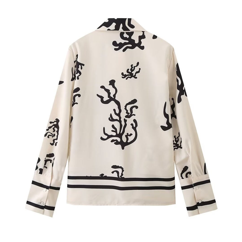 Elegant printed shirt and trousers set
Black and white co-ord for women
Stylish wide-leg pants outfit
Chic vacation outfit for women
Long-sleeve button-down shirt set
Trendy two-piece matching set