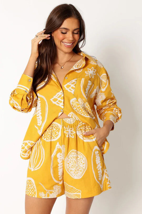 printed two-piece tropical outfit

casual matching lounge sets

women’s summer matching sets

resort wear for women

trendy fruit print clothingtropical fruit print outfit

button down co-ord set

women’s resort set

elastic waist tropical shorts

two piece casual lounge set

relaxed fit vacation outfit


