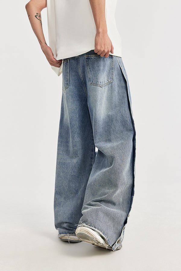men's wide-leg jeans, ripped denim, vintage wash jeans, baggy streetwear jeans, loose-fit jeans, trendy men's denim, casual street style, frayed knee jeans, urban fashion.